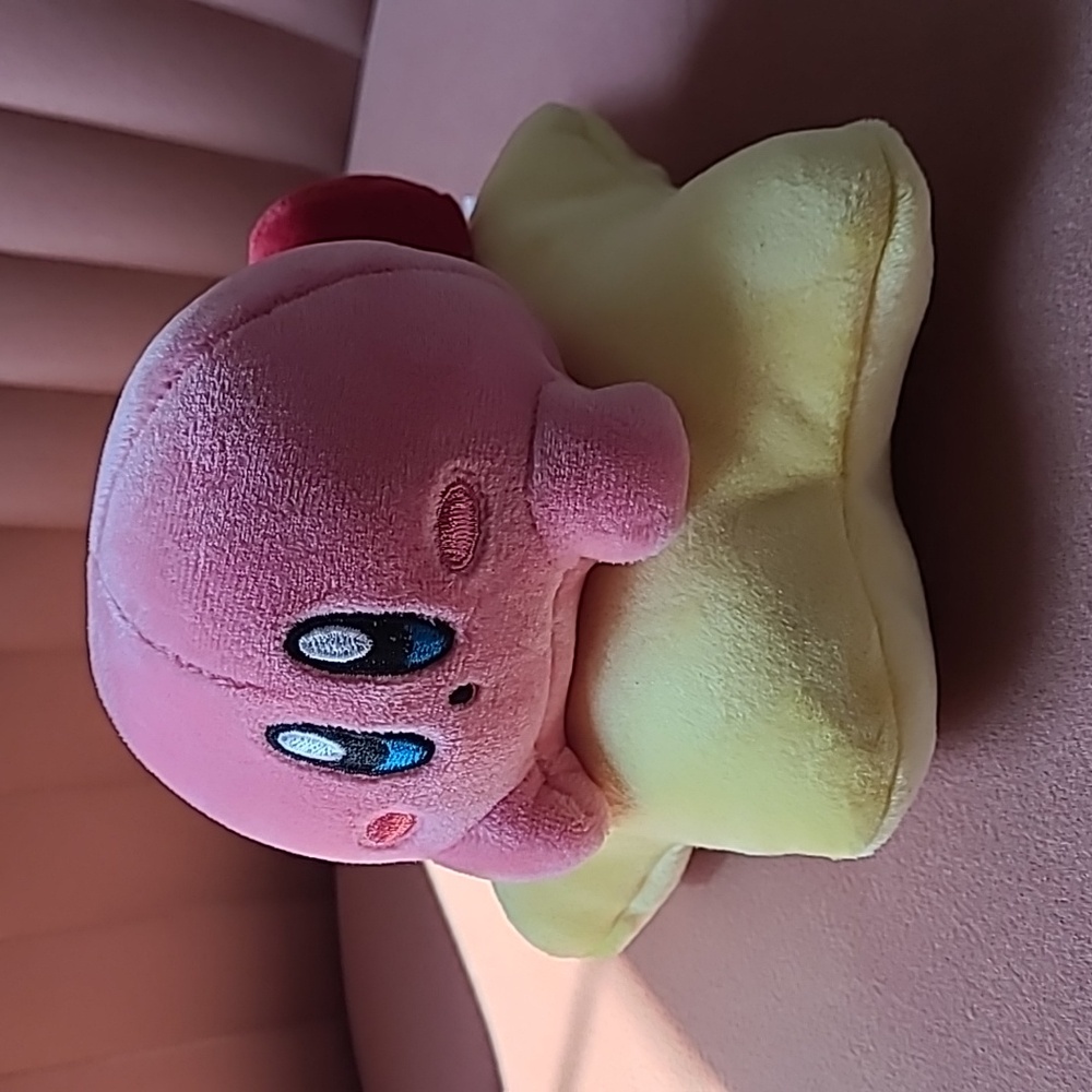 Pink Kirby Plush Toy on Yellow Star